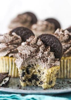 An Oreo Cupcake on a Serving Platter with a Bite Taken Out of It