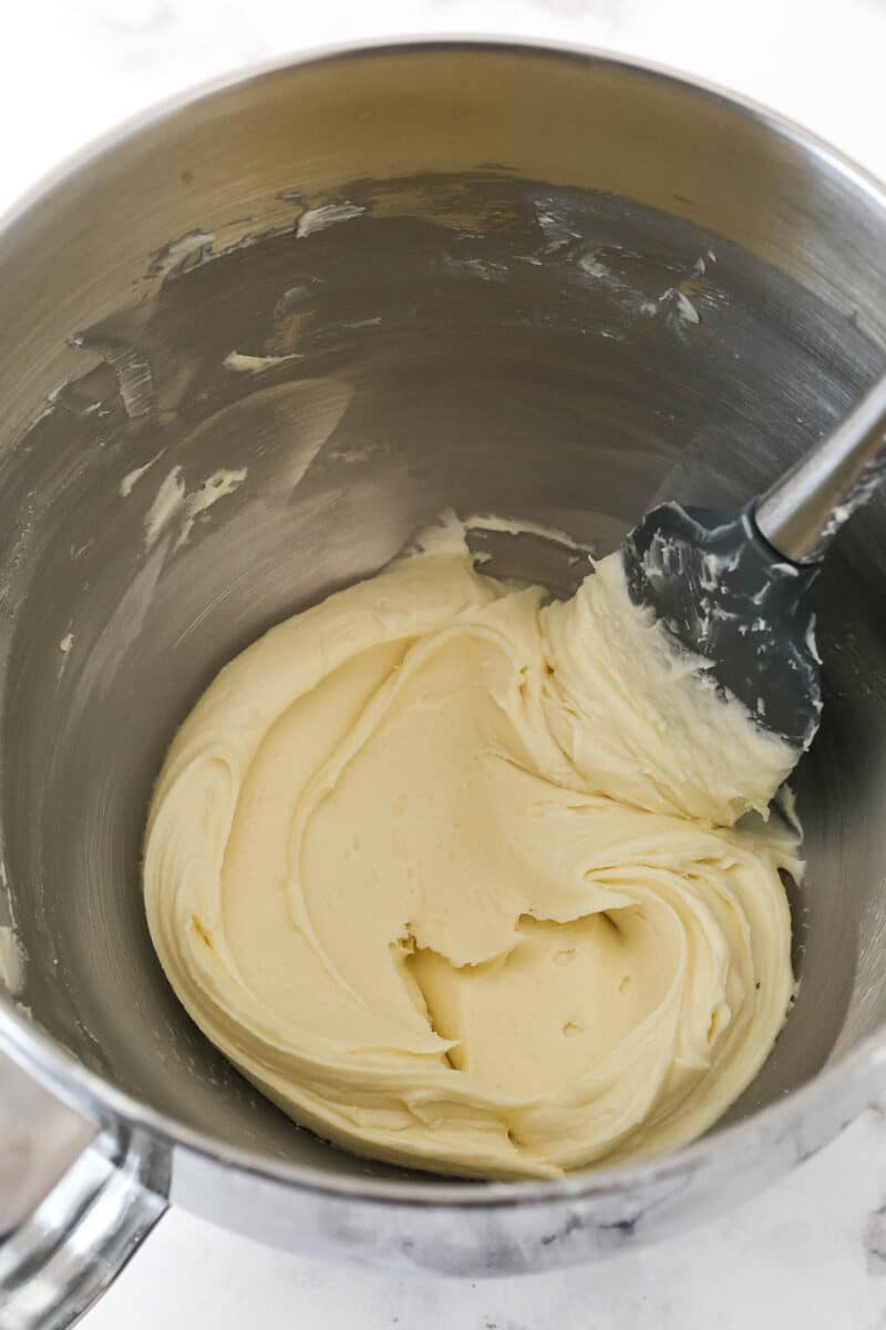 Maple buttercream frosting in a metal mixing bowl