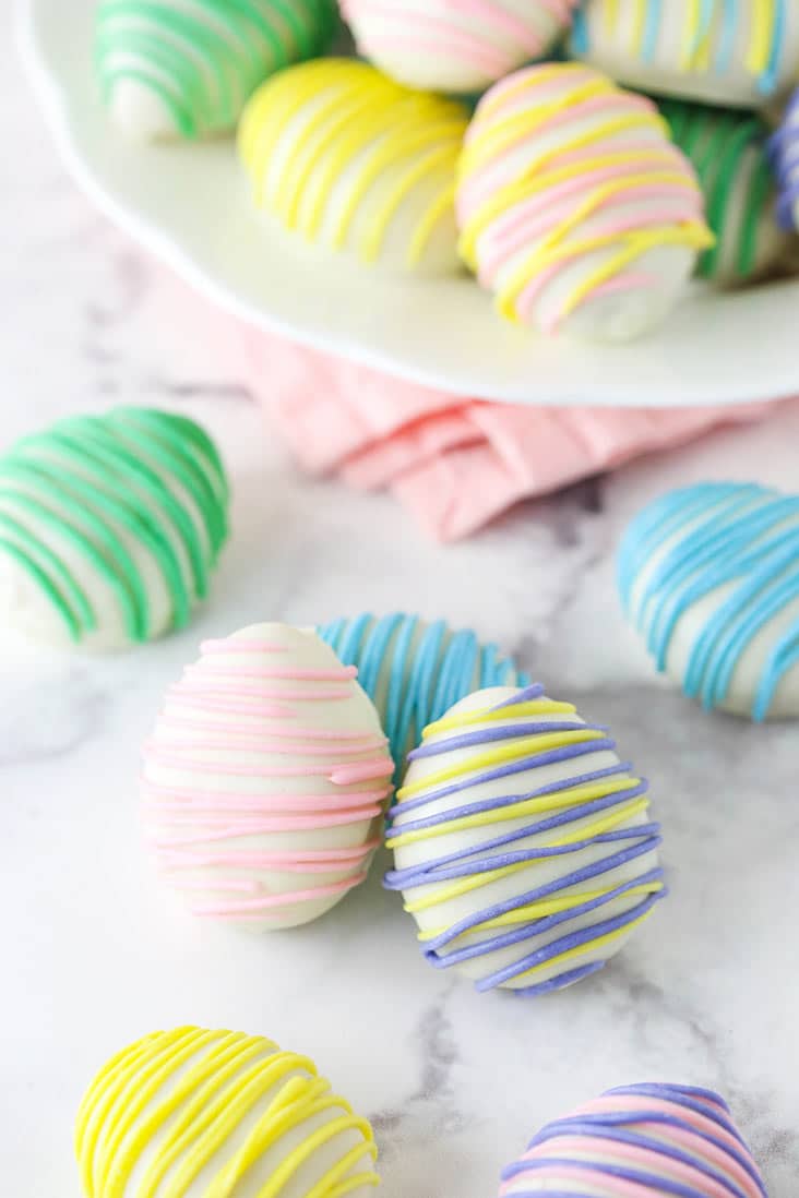 bundle of three easter egg oreo cookie balls with some others scattered around