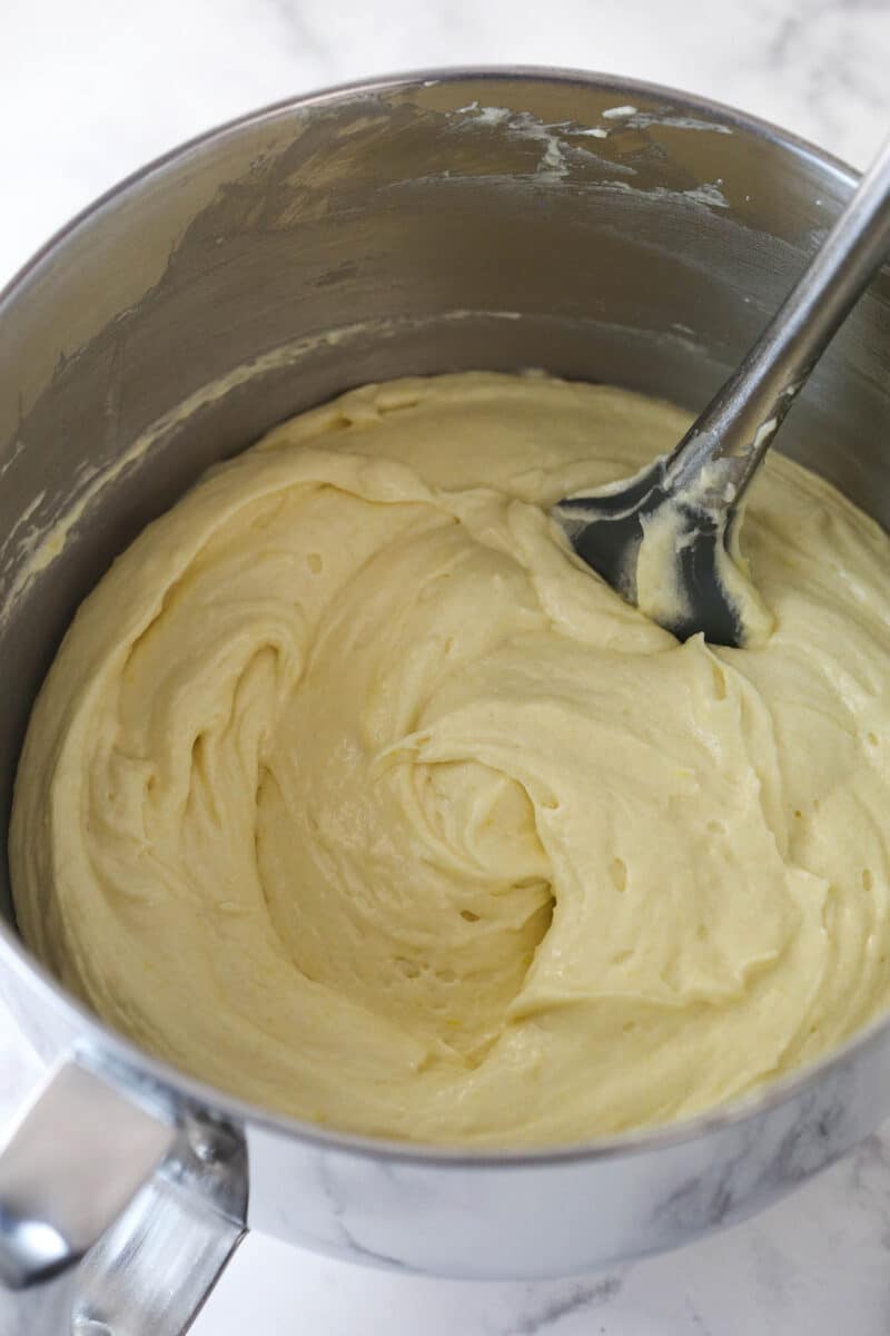 Mixing dry ingredients into wet ingredients for cake batter.