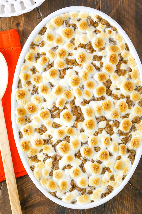 Overhead view of Sweet Potato Casserole with toasted marshmallows on top in a white baking dish
