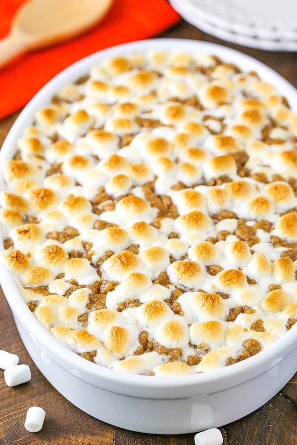 Sweet Potato Casserole with marshmallows and streusel topping in a white baking dish