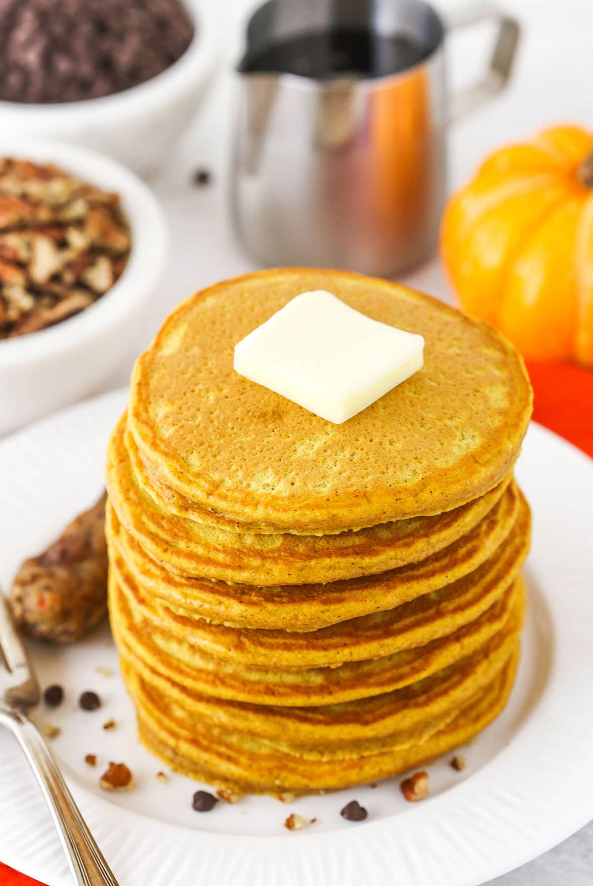 Fluffy Pumpkin Pancakes Topped with a Square of Butter