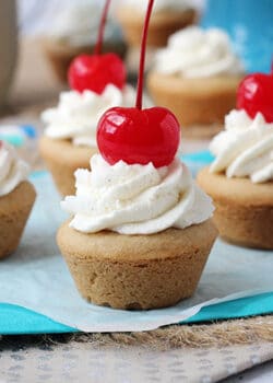 Root Beer Float Cookie Cups topped with a cherry
