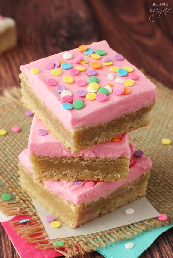 Pink Frosted Sugar Cookie Bars in a stack